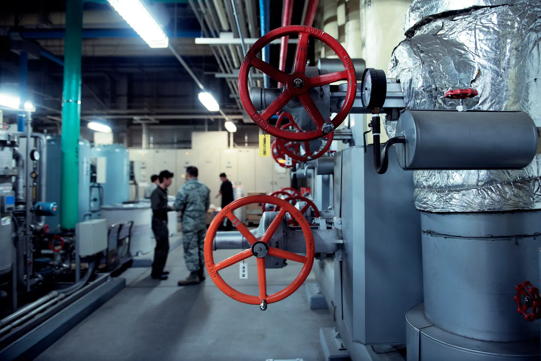 Heating plant with valves, gauges and insulated pipework in a clean mechanical room